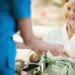 Nurse Holding Hands with Elderly Patient
