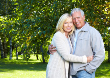 Happy senior couple relaxing in park. Golden age.