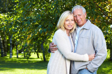 Happy senior couple relaxing in park. Golden age.