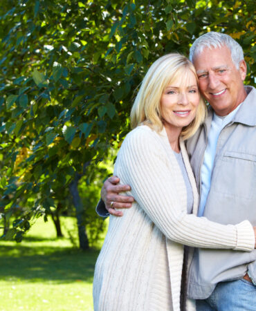 Happy senior couple relaxing in park. Golden age.
