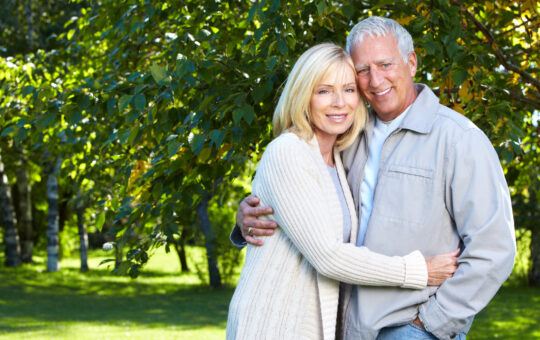 Happy senior couple relaxing in park. Golden age.